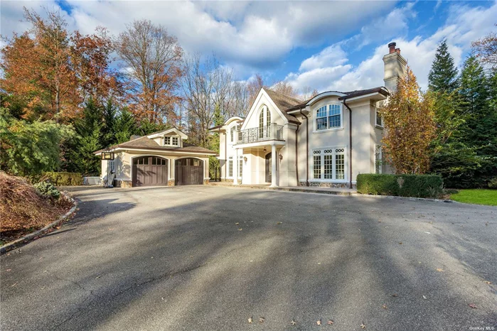 Old Westbury. A gated courtyard leads to this splendid all-season luxurious, renovated modern-day mansion on a shy two acres in the sought-after prestigious Village of Old Westbury. There is a dramatic two-story entry with soaring 10-foot ceilings throughout the first floor. A large living room with fireplace is across from a banquet dining room with fireplace next to an updated eat-in kitchen adjacent to a den with wet bar. There is also a separate home office. A curved staircase leads you upstairs to a spacious primary suite with marble bath, shower, and Jacuzzi. Four additional bedrooms and two full baths. The ground floor hosts an entertainment center with a pool table and wet bar, a separate home theater, bedroom with a full bath. A gym area with bathroom includes two separate shower rooms and steam/sauna. There is a regulation bowling alley. All that leads to a gunite pool waterfall, patios, gazebo, and exquisite professional landscaped gardens.