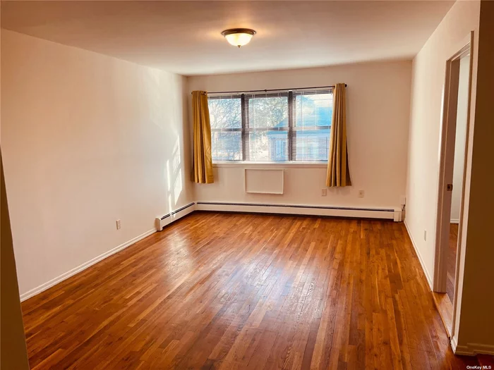 Lovely and Spacious 3BR 1.5 Bath Apartment , EIK, Hardwood floors throughout , separate Thermostat in apartment. Master bedroom with Walk in Closet, and plenty other closet space throughout. Basement offers shared Laundry Room with Washer / Dryer ! Located in Fresh Meadows and near to transportation, schools, shopping etc! Waiting for you to call it home!