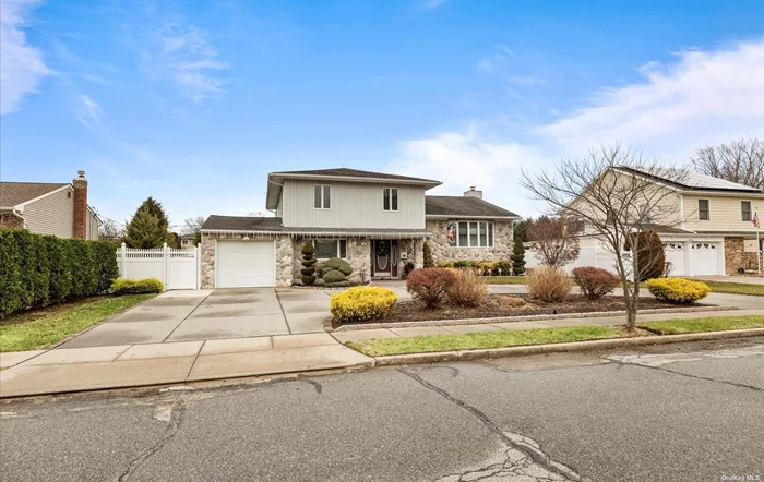 Beautifully updated home in Bethpage, Midblock location. Must Be Seen to Be Believed this Renovated Home for large family, Spacious open layout floor plan, this warm & inviting home features, One Bedroom and half bath on the main floor, Basement, large family room, Entrance from yard, wet bar with granite countertops. Steps into Kitchen, Living Room, Dining room. Double sliding doors onto the covered outdoor deck, Perfect for family year-round entertaining. Top level 3 bedrooms, 2 full updated bathrooms. (Room for a pool in backyard) professionally landscaped, with a shed, patio, inground sprinklers, and perfect for entertaining! Just Move in and Unpack in Your One-of-a-Kind Dream Home! Close to shopping, Parks & transportation.