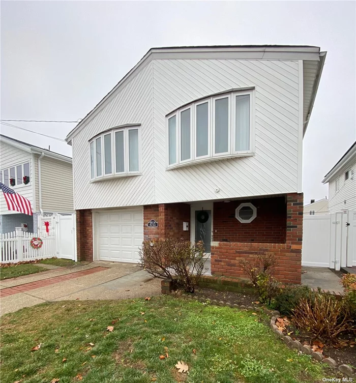 Beautiful Newly Renovated Split Level Home with all new Stainless Steel Appliances, Hardwood Floors, & New Plumbing and Electrical This 4 bedroom/2 bathroom can be used as a possible Mother/Daughter (separate entrance!)