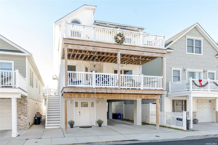 Enjoy Ocean Views From This Unique Fabulous 5 Bedroom Fema Compliant Home in the Desirable West End of Long Beach! Main Floor: Family Room with Wetbar Area, 3 Bedrooms, Full Bath and Entrance to Covered Deck. 3rd Floor: Open Layout with Cathedral Ceilings, Living Bedroom w/Gas Fireplace & Sliders To Ocean View Deck, Formal Dining Area, Kitchen w/Granite Counters, Primary Bedroom Ensuite, Bedroom, Full Bath and Laundry Closet. Ground Floor Features Covered Parking for 2 Cars and Oversized Finished Storage Room. Seconds to Local Restaurants, Shops, Public Transportation & the Beach!