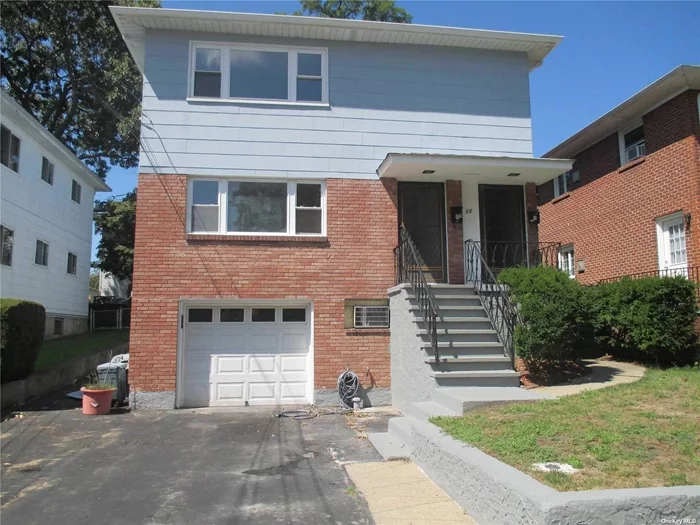 Lovely 1st Fl. Apt. Re-Furbished Hardwood Flrs, Master Br W/Sliders To Yard Plus 2 Add Br&rsquo;s, New Kitchen & 1 Bath. L.R., Dining Area, Bright & Sunny Apartment. Basement (Huge) W/Outside Entrance & 2 + Large Rooms and Laundry Room with Washer and Dryer.  Sole Use Of Yard & 1 Car Garage Plus Additional Off Street Parking For Second Car. Manorhaven Schools. 3 Window A/C Units Included. Convenient To Manorhaven Pool, Beach & Tennis! All Rooms Are Being Freshly Painted!