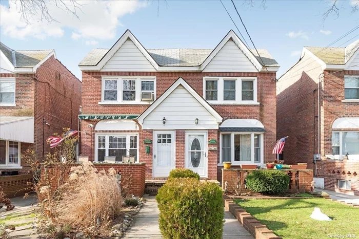 Beautiful Updated Home in the Heart of Ozone Park. Featuring 3 Bedrooms & 2 Baths. Wood floors, E-I-K, Front Porch, & Large Finished Bsmt Apt With a Kitchen & Outside Entrance (Potential Mother/Daughter W/ Proper Permits). Spacious Backyard With 1 Car Det Garage,  Charming Home Garden. Very Close To Bus Q7/B15 And Train A Takes You To Manhattan or JFK Airport.