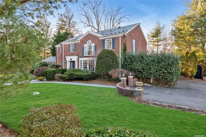 Impressive Brick Georgian Colonial perfectly positioned on a picturesque winding street in Strathmore Vanderbilt, close to Country Club. Blending sophistication & functionality this approximately 3, 200 sq ft home provides an open concept plan with traditional decor that can be easily transitioned to today&rsquo;s modern living. The front to back foyer introduces the banquet size dining room with bow window and the formal living room, adorned with a wood burning fireplace and an array of arched windows plus a door to a verandah. All are exquisitely trimmed with moldings and columns. Adjacent is a den or office with fireplace. The rear facing kitchen boasts an informal dining area, wood cabinets, modern appliances, surround sound and sliders to patio. The lower level features a 1500-bottle wine cellar. Second floor offers a marvelous principal room with marble bath plus three bedrooms & bath. With wave air ventilation throughout. All on a .34 beautifully landscaped lot. Taxes never grieved.