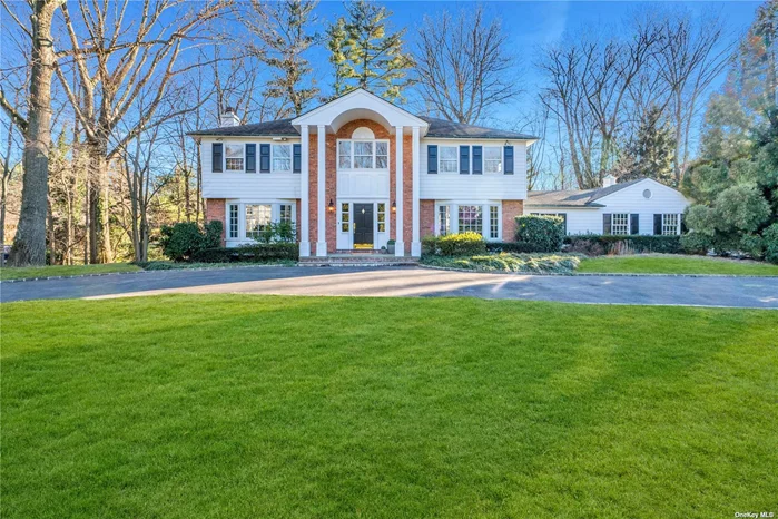 A true Center Hall Colonial on the most sought after street in Flower Hill. Sitting on nearly 1 acre of land, this gorgeous home impresses with its striking Grand Entry and gracious Principal Rooms. The first floor boasts an Eat-In Kitchen, Formal Dining Room, Living Room with fireplace, Family Room with fireplace, Bedroom, 1.5 Bathrooms, and a Mudroom. Upstairs you will find a generous Primary Bedroom Ensuite, 3 Bedrooms, and an additional Bathroom. Full Basement. Close to train. Port Washington Schools.