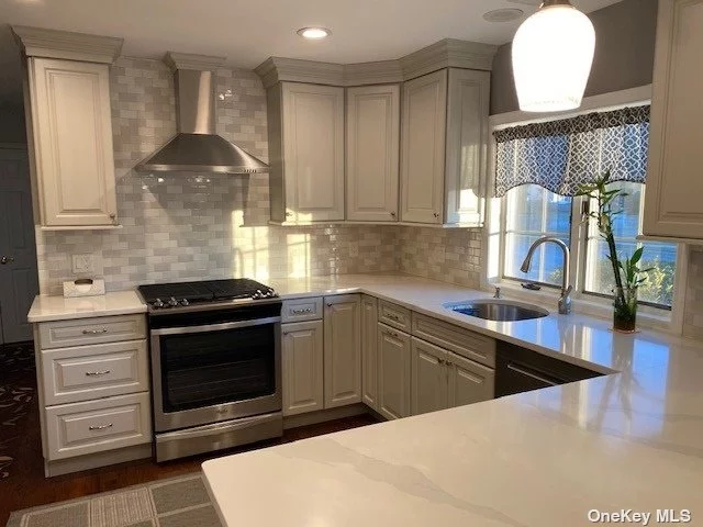 Extremely well maintained home, renovated in 2019 with all Red Oak hardwood floors through out 1st fl. Quartz counters atop gorgeous cabinets w/large pull out pot drawers, large island, 5 Gas burner stove with overhead exhaust, Stainless Steel Appl, Stoned fireplace with Ledge Stone Quartz, Updated Bath, CAC, GAS HEAT/COOKING, New Washer, Dryer, All new windows in 2017, New Sliders to yard, 2022, 4 Nice size bedrooms, 1 Bath, Living Room, Dining Room, EIK, Entry Foyer. Large yard, fully fenced with white vinyl.Great Home to Entertain in and State of the Art Library near by, Town Pools, Close to shopping, Railroad and schools. DO NOT MISS THIS HOME! Pictures of this home to follow