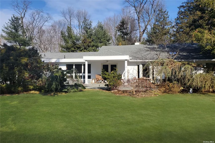 Discretely tucked behind a running wall and with gated entry, this home exemplifies the best of single-story living. Its floorplan is both spacious and sensible, providing space for gathering and for privacy. Magnificent 2+ acre property with pool. So many extras! Very special offering.