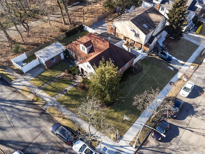 Welcome to this oversized single-family home that sits on a Quiet Cul-de-Sac over 7, 000 sqft corner lot in the Heart of Bayside/Oakland Gardens, This sundrenched house boasts 3 bedrooms and 2.5 baths. The First floor is an Open floor plan living/dining room with a fireplace and office space with a skylight, a kitchen with a custom cabinet, and a sliding door that can access the side yard. There are additional 2 bedrooms and a full bathroom on the first floor. The master bedroom on the second floor features a walk-in closet and a full bath. The full basement can be used as a laundry room or extra storage space. Additional Features: detached 1-car garage and private driveway. The property is in move-in-ready condition and located right next to Vanderbilt Motor Pkwy. Excellent School District 26