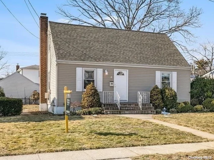 This Lovely CAPE Features 3 Bedrooms - Good Size Livingroom, Formal Dining Room, Eat in Kitchen GAS COOKING with NEW Appliances- Access to Patio and Yard Updated Full Bath 2010 -Like New ROOF, WINDOWS, SIDING, BURNER & AG Tank, Full Basement, Convenient to All, LIRR>SHOPS>SCHOOLS.