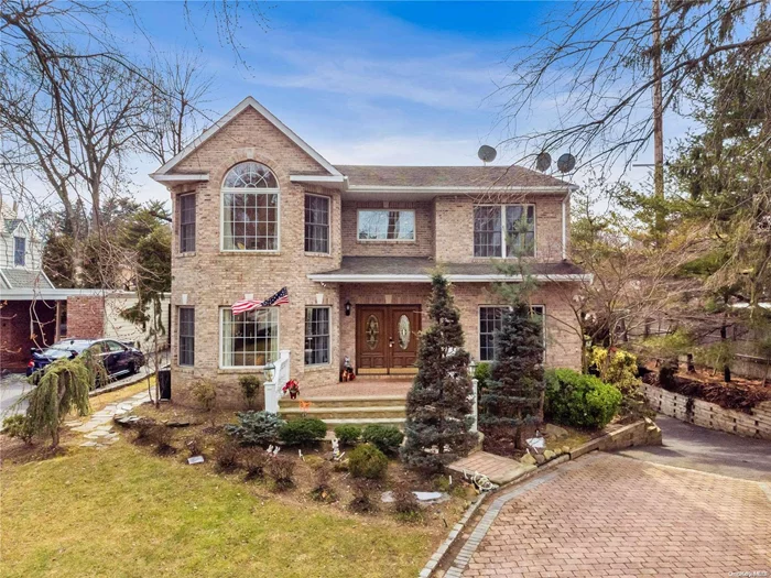 Welcome to this stunning custom-built colonial home in Flower Hill Roslyn. This approx. 3000sf home boasts 4 bedrooms and 3.5 baths. Upon entering, guests are greeted by a stunning two-story grand foyer. On the main level, there is a spacious living room with a fireplace, a formal dining room and a sliding door to the backyard. The chef&rsquo;s kitchen showcases quartz countertops with a granite top breakfast bar and custom cabinets. On the second floor there is a master bedroom with a spa-like en-suite bathroom, 3 more bedrooms, and a full bathroom. The property offers lofty and open living space, which features ample windows, airy ceilings, custom trim and crown moldings. The basement provides an extra space for recreation and storage. A 2-car garage and long private driveway can park multiple cars. Located at the prime location of Roslyn, it is 2 minutes&rsquo; to Americana Manhasset Shopping Center and Wholefood. Roslyn School District! *LOW TAX!* This Home has so much to offer!