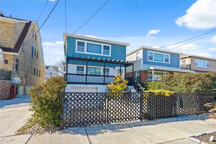 Welcome to Belle Harbor! This super well maintained two family home sits only 9 houses away from the Beach. Conveniently located at the end of the Rockaway Boardwalk, for those that want to enjoy the Ocean all year round. This two family home will be delivered vacant at closing. The first floor is a well designed 3 bedroom, 2 full bathroom apartment with access that leads into the basement. The basement is immaculate, with good ceiling height and is currently used a recreation area with storage, and a deep 2 car garage. The second floor is a large 2 bedroom 1 bathroom apartment that has ocean views from the balcony as well as from the living room windows. The front yard and back yard were meticulously landscaped with plants, pavers, flowers, the ideal private retreat after a long beach day. There is an outdoor shower to wash that sand away.