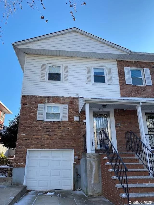 Unique Large 4 Level Split In Prime Country Village Location. Hardwood Floors. School District #26. Walk To P.S. 203 and Cardozo High School. Convenient Transportation - Q27, Q30 And Express Bus to Manhattan. Must See.