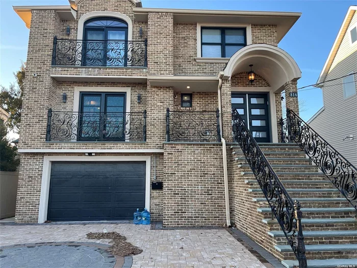 Magnificent Home in the Heart of Woodmere constructed in 2020, 5 Bedrooms, 3 Full Bathrooms, detailed moldings throughout, maple wood floors, Anderson windows + doors, custom closets, dimmers & timers, 2 zone CAC, EIK w/2 sinks, 2 dishwashers, 2 microwaves, double oven, island, close to all. Sound system, camera system, 4 car driveway..