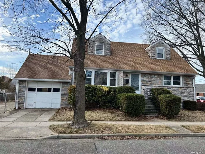 Four bedrooms and two baths house with garage in Garden City S. Near schools, park, golf courses, L.I.R.R., shopping and dining, Hempstead Turnpike.