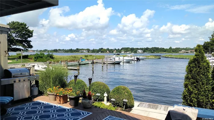 Welcome to The Club At Bayberry Harbor. This private community boasts stunning water views of The Great South Bay. A deeded boat slip is just steps away from your private deck. Renovations (2017) incl new gas heat, air conditioning, new 1st flr bath, updated 2nd flr bath, new second level floors, new lighting, new built-in wine rack, new windows, new roof (2020), new landscaping, renovated deck and exterior. A full spacious sauna and hot tub await upstairs! In-ground community pool just steps away with lush greenery. Gorgeous coveted community amenities include tennis court, arboretum, deeded slip in marina w/elec & water, private beach, new clubhouse with kitchen & bowling alley. Pets are welcomed! X Zone -Flood Ins NOT required. Enjoy a sunset toast with your loved ones and the amazing neighbors in THE CLUB!