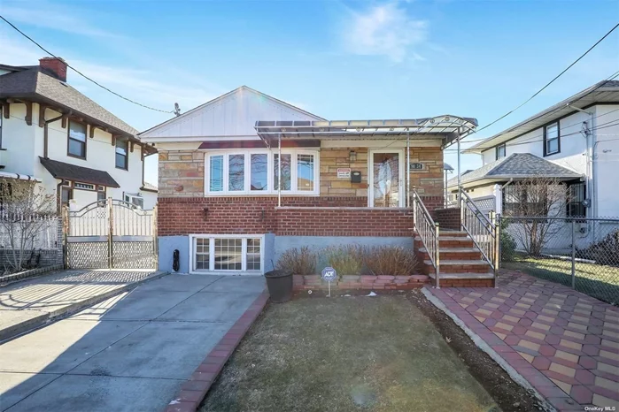 Immaculate home in Queens Village. Entry foyer w/double wide coat closet. Open LR, DR, EIK. Kitchen is completely renovated w/brand new, unused stainless steel appliances, quartz counters + porcelain floor. King sized master br w/full ensuite bath. 2 addt&rsquo;l queen sized brs + full bath w/double sink. Lower level boasts ceramic tile floor throughout. A spacious family room, 2 more brs, small kitchenette, full bath + laundry rm w/brand new washer + dryer. Outside entrance to backyard. Features: Private porch w/stainless steel awning. Crown moldings. Well kept hardwood floors on main level. Attic storage. Security system. Roof 10yrs old. All new windows. Solid oak doors on main level. 2-zone central air. 4mo old water tank w/extended warranty. 50 gallon dry well. Easy parking and two car driveway w/greystone pavers.