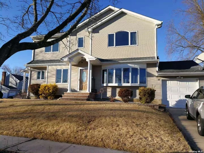 Location! Location! Location! This home was completely remodeled and extended in 2012 and renovated in 2021. The owner changed the drainpipe underground in 2022. Beautifully updated inside & out, spacious colonial in sought-after Syosset Groves W/ fabulous open floor plan, EIK, wood floors, 5 huge BRs, including one on the main level, full BSMT and garage. Realtors Must Accompany Clients.