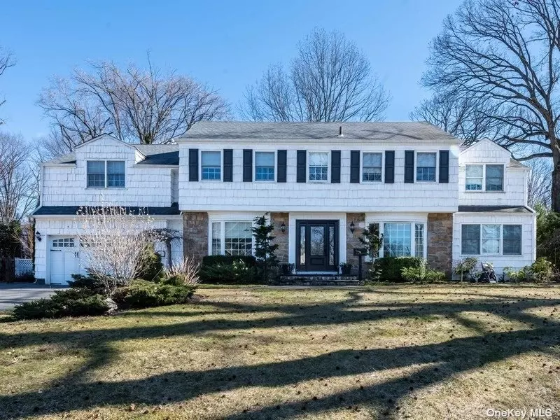 Magnificent 5-Bedroom Fieldstone/Shingle Colonial on Corner Property in the Heart of Lake Success.