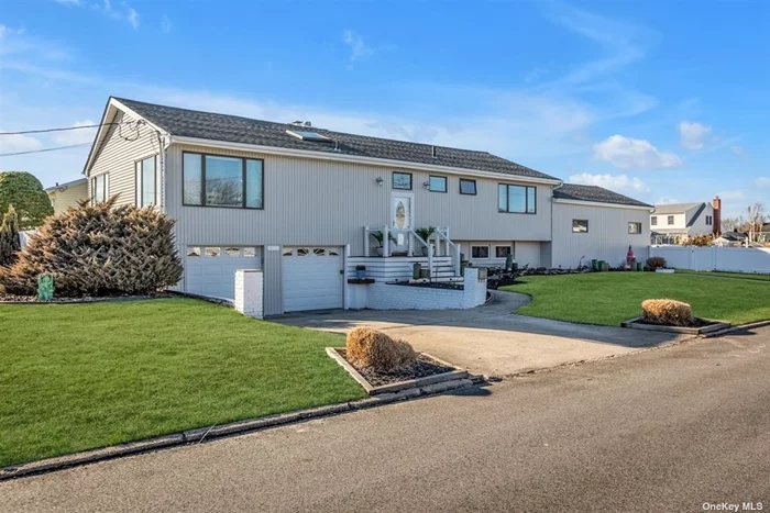 Beautiful wide line raised ranch with 85&rsquo; updated navy bulkheading. Home affords much space, 3, 332 Sq Ft for a large family! Many updates in eat-in kitchen and bathrooms. High vaulted ceilings with a sky light enhance the open look. Possible accessory apartment, check local zoning or proper permits.