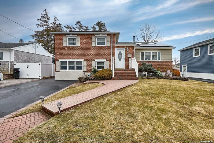 Totally Renovated & Updated Brick Split. Mass. SD # 23. Unique 1st Floor Open Concept. Gleaming H/W Flrs., Liv. Rm. w/ Vaulted Ceiling & Skylights, Corner Glass Encl. Wood FPL, FDR w/ Sliders To Deck/Yard, New Granite Counter/Island EIK w/Vaulted Ceiling/Skylight. 2nd Floor: H/W Floors, MBR with 1/2 Bath, 2 Add&rsquo;l Br&rsquo;s & Large Jacuzzi Tub Hall Bath. Huge Lower Level Family Room, Full Bath. Part Fin Bsmt w/ Laundry & High Efficiency Gas Heat System. Updated windows throughout,  Owned Solar Panels-Low Energy Bills. Low Taxes !!