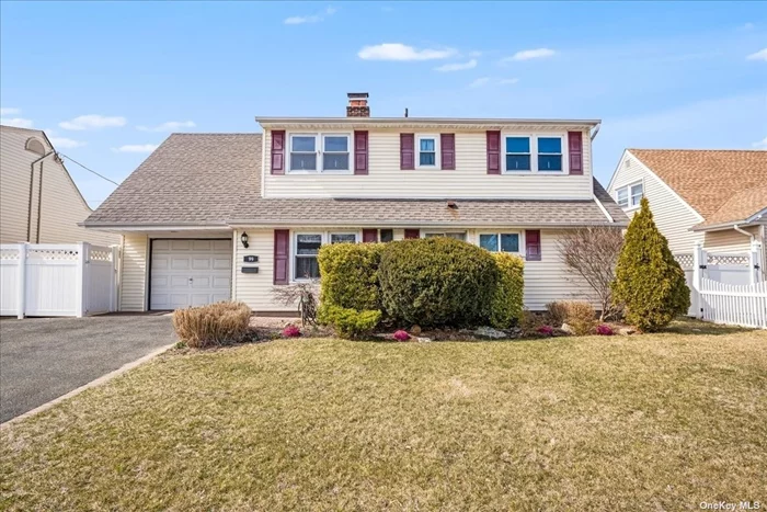 Expanded Dormered Levitt Ranch w/Hardwood Floors! 5 Bedrooms & 2 Freshly Painted Full Baths, Charming Eat-In-Kitchen w/Updated Stove & Dishwasher, Formal Dining Room w/Wood Burning Fire Place, Extended Raised Living Room w/Built in Shelving, Lots of Windows & Access to the Fenced Yard w/Cement Patio, Primary Bedroom On 1st Floor, Bedroom, Office & Full Bath, Floating Staircase Leads to the 2nd Fl Oversized Bedroom, 2 Addl Bedrooms & Full Bath,  Dryer in 1 Car Garage & Washer & Heating in Kitchen, 100 Amp Electric, Above Ground Oil Tank, Some Updated Windows, Roof in Middle of Life, 11 Year HW Heating, NYS Star $1190, True Taxes $16, 625, Tax Grievance in Process, Sparke Elementary