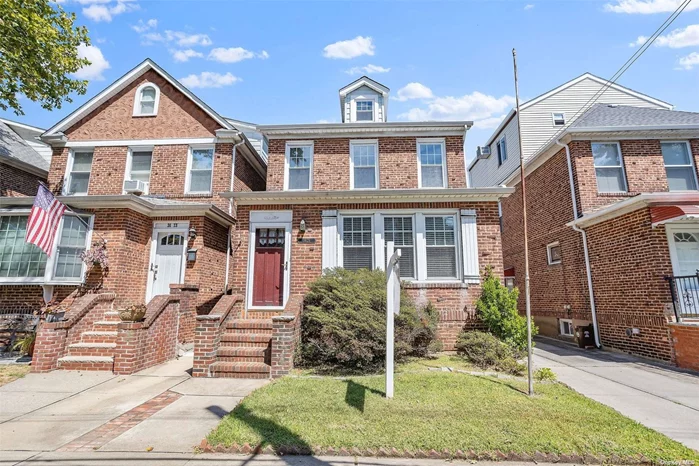 Wonderful all brick 4 Bedrooms house with Spacious Living Rm, Formal Dining + Eat-In Kitchen ! hardwood floors throughout, Wonderful walk up attic. Private driveway With 2 car garage. Convenient to LIRR and all mass transit, shopping, and houses of worship. District 26 schools, R3A zoning.