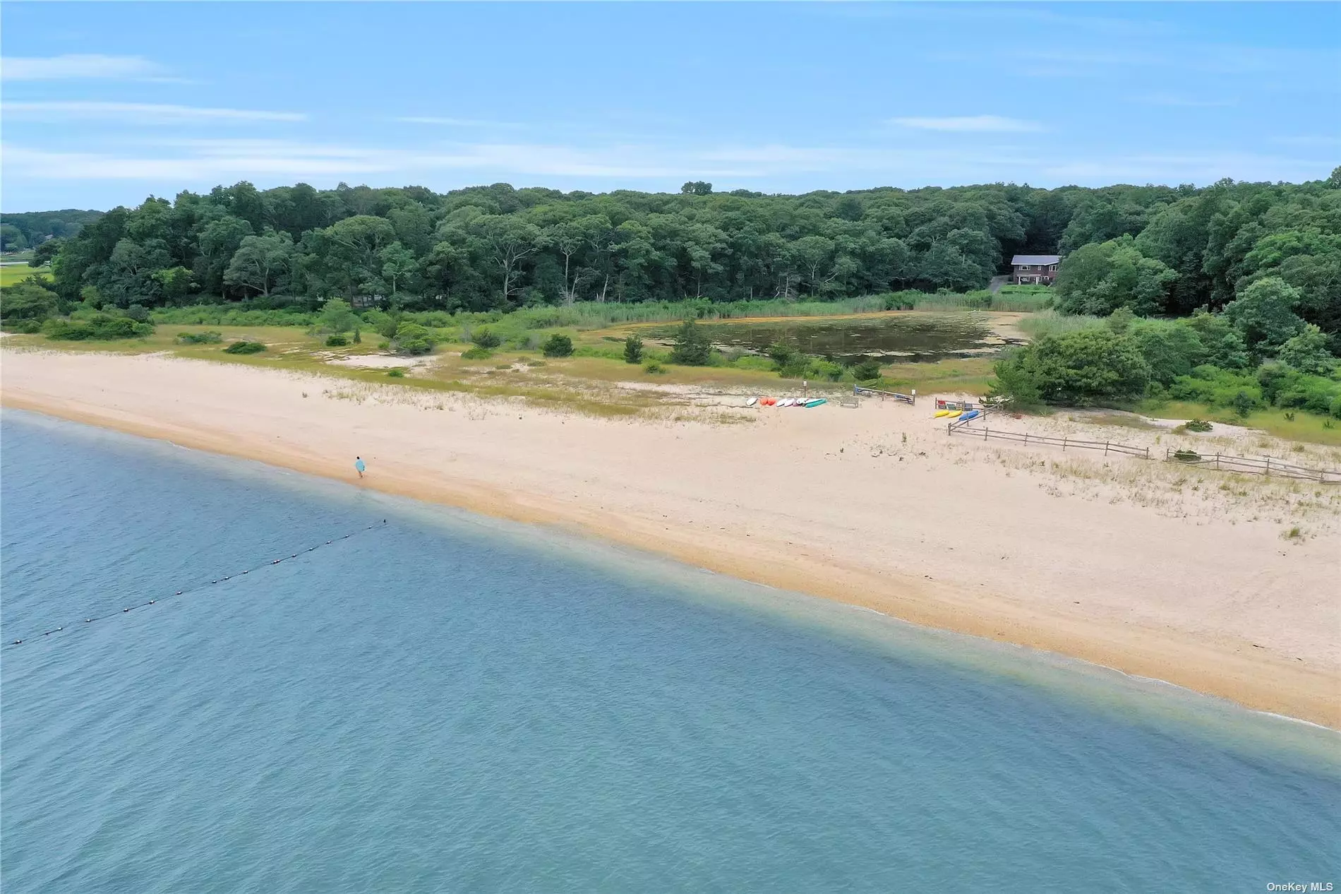 Arrowhead Cove, Peconic- A rare opportunity to build your dream home in this premier location with one of the best bay beaches on the North Fork. Beautiful, corner one acre parcel. Level, with southern and westerly light, and gorgeous sunsets. Arrowhead Cove Association&rsquo;s 240-foot-wide sandy bay beach is a short stroll away. A natural wildlife, three-acre tranquil pond adjoins the beach and welcomes ice skaters. Richmond Creek boat ramp is nearby. Close to restaurants, farm stands, wineries, breweries and all North Fork activities.
