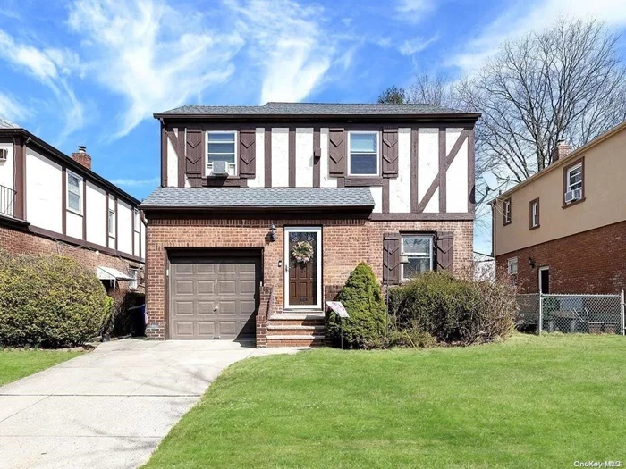 Beautiful 3-bedroom 2 full bath Tudor nestled in the heart of Bayside Hills. This charming home sits upon a 40 x 100 lot with a large fenced yard and patio. Private driveway with an attached 1 car garage. Enjoy the comforts of Bayside close to shopping, schools, and transportation