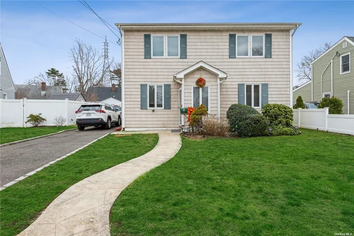 Updated Beautiful 3BR, 2 Bath Colonial on a quiet street in the Hewlett Woodmere school district #14. Large eat-in-kitchen with updated appliances. Nice hard wood floors. Long driveway and lovely spacious backyard. Close to all including LIRR. Very large bedrooms