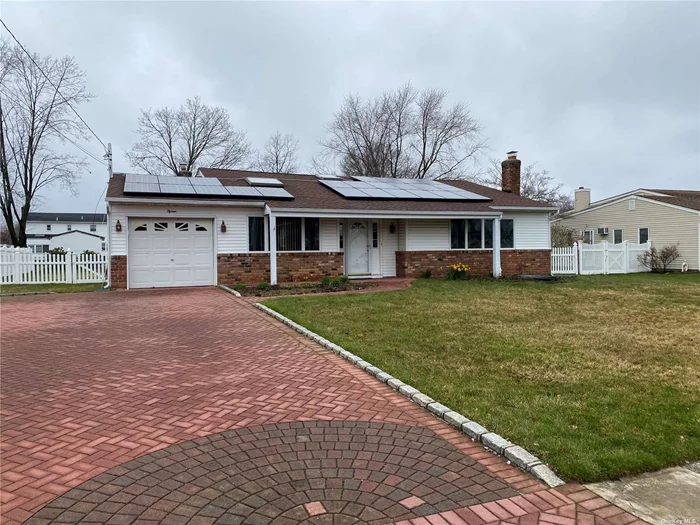 Spacious 4 Bedroom 1.5 Bath Located On A Beautiful Block w/ Sidewalks. Also Features Living Room w Fire Place, Large Family Room, EIK, Laundry Room,  Pavered Driveway, CAC,  Wood Floors & Large Backyard . Needs Some Updating... A Must See!!