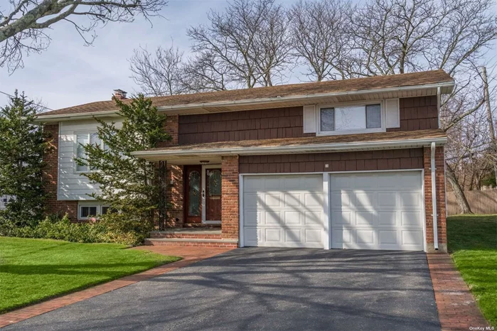 Wonderful Opportunity To Live In Desirable Syosset Woods. Three Bedroom, Two Bath, High Ranch With High Ceilings Offering Unlimited Possibilities. Two-Car Attached Garage. Walkout Basement. Beautiful Backyard.