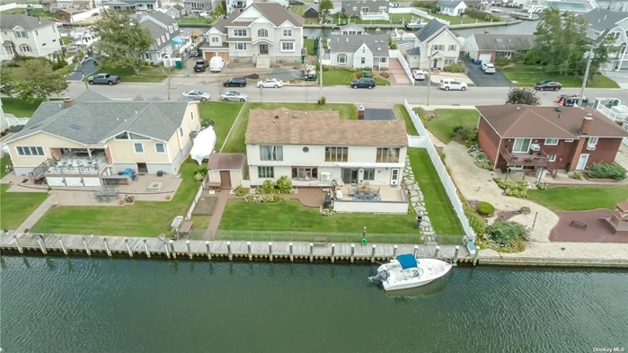 Paradise is affordable! Beautiful, spacious (3300+ sq ft) waterfront home with bay views! New/recent: 2015 90&rsquo; Navy bulkhead and dock, 2010 driveway, 2008 roof, 2012 heat & electric, 2014 kitchen, 2017 master bath. Awesome living/family/entertaining with open layout and great flow. Crown moldings, pristine wood floors, etc. Seeing is believing and falling in love!