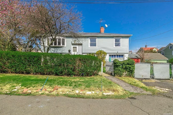 Legal 2 Family by C/O Hi Ranch. Upper Main Level Boasting Formal LR/Formal DR, EIK, 3 Bedrooms, Full Bath. Lower Level Consists of LR/Kitchen Combo, 1 Bedroom, Full Bath, 1 Car Garage. Fenced Location, Newer roof, heating system, hot water heater. Close to Local Beaches & Ferry to NYC.