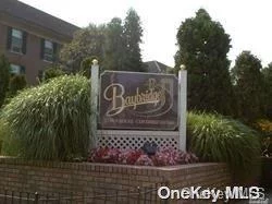 Baybridge condominiums has so much to offer. 2nd fl. hard to find end unit. True three  bedroom which has been converted to a two bedroom & created a beautiful study/office. This unit features open floor plan with wood floors, Glass French doors enclose this private office. EIK, 2 full baths, Terrace, W/D. Partial Waterview from the MBR, private bath, & Bay Window. Ample closet space. Storage in basement, reserved parking. A few steps away to the recently updated health club which boasts 2 pools, tennis, racquetball , sauna etc. Regular exercise classes and community functions for all ages and interest.. Convenient to buses, LIRR, and all highways.