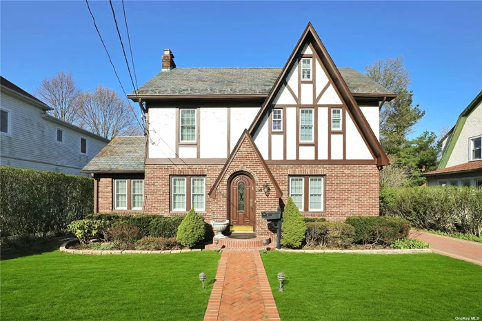 Great Neck - Welcome To This Renovated Tudor Featuring An Over-Sized Living Room With Fire Place, A Formal Dinning Room, Eat In Kitchen, Finished Attic, and a Full Finished Basement As Walk Out Through The Bilco Doors. This Sun Filled Home Offers New Windows, Slate Roof With Roof Ice Melter, Door Mat De-Icer, Central Air Conditioning, An Updated 200 AMP Electric Panel With A Stand Alone Generator, Sprinkler System, New Pavers From Street, Wrapping All The way Around To The Back Yard, Continuing To The Newly Built 2 Car Garage With Finished Storage Space. This Bright & Sunny Home is in Close Proximity To Shopping & Public Transportation.