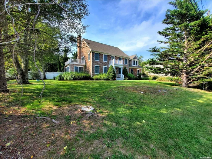 Beautiful like new colonial just 500 feet from sandy bay beach. Four bedrooms plus a lovely sunroom. Enjoy your morning coffee on the balcony. A perfect beach house.