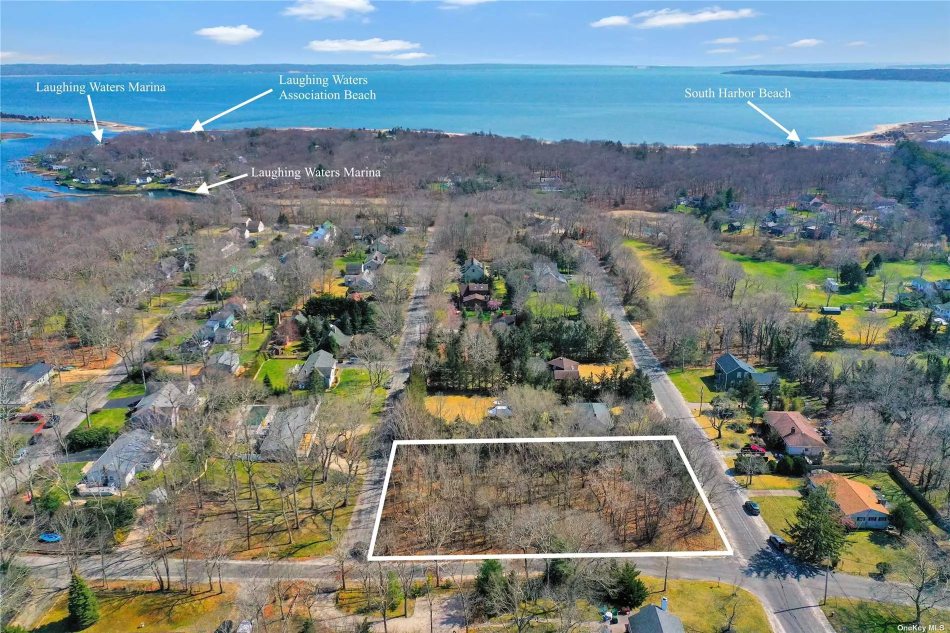 Southold - Laughing Waters - Beautiful corner .6 acre parcel with Southern and Western exposures. A rare opportunity to build your dream home in this sought-after, well established community of Laughing Waters. Enjoy all the amenities that come with Lauging Waters property ownership while you own this vacant parcel, and while you plan and build your home. The Association deeded sandy bay beach, 2 marinas and boat ramps are part of this package and South Harbor Beach and Croteau Vineyards are just a stroll away. Close to restaurants, farm stands, wineries, breweries and all North Fork activities. Your quintessential North Fork beach house or year-round residence awaits. Yes, location still matters.