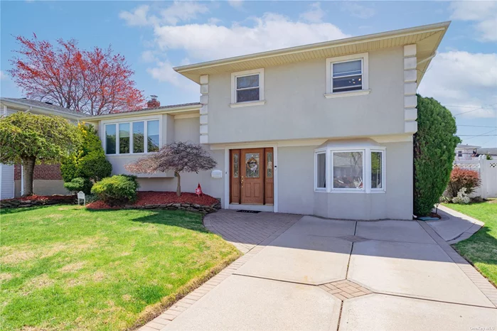 Tree-lined, quiet pocket of this Bethpage home welcomes you to a beautiful entry foyer complete with a huge closet. Clean, freshly painted 3 Bedroom, 2 Bath, Living Rm, Dining Rm, Kitchen, with office space and rec room plus a finished basement completes this interior package. Perfect for extended family. Landscaped backyard with covered patio, 10-year-old roof, 1 yr. old gas heating system makes this home move-in ready.