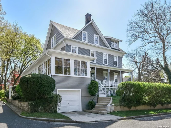 This amazing 4 bedroom 2 bth sun-drenched Victorian sits high with beautiful views from the amazing year-round sun porch with walls of glass. This astounding home boasts 2775 sq. ft., has soaring ceilings and many period details, completely restored, gleaming hardwood floors. Walk-up Attic etc... The Basement, with high ceilings, is sun filled and offers a full walk out to the huge yard. Attached 2 car garage, new roof, new siding, new washer & dryer. Second adjacent lot is available for a SEPARATE SALE! $599, 000, for either your own seclusion or build a second home up to 2300 sq ft with a 2 car garage. This lot is already subdivided.