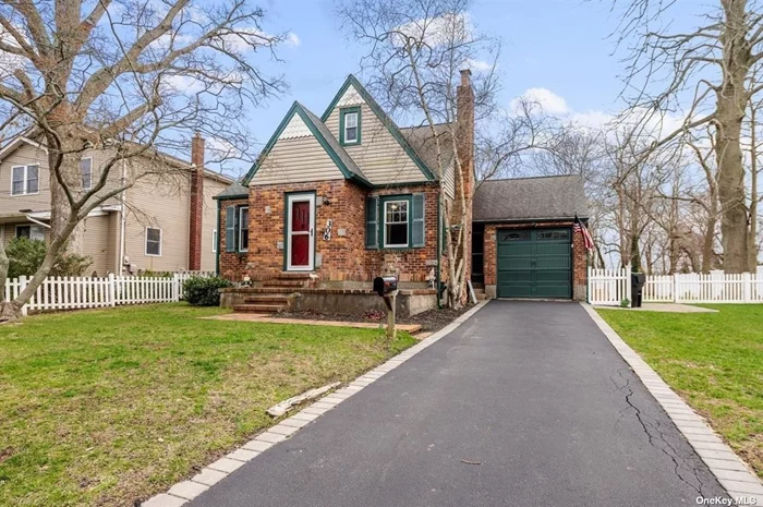 This Beautiful Tudor is FIlled With Classic Charm & Invites You in With its Arch Doorways, Crown Moldings, Hardwood Floors, Large Living Room w/Fireplace, Kitchen & Bathroom Have Been Updated While Still Maintaining the Classic Feel. The Backyard With Trex Decking, Fully Fenced Oversized Property is Great For Entertaining!!