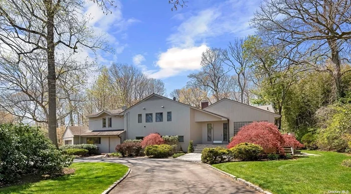 Expanded 5 bedroom, 4.5 bath split in The Gates of Woodbury. Great home with spacious rooms. Open flow living room/dining room with wood burning fireplace and wall of windows & sliders to oversized deck. Chef&rsquo;s kitchen with granite countertops and stainless steel appliances. Primary Suite with a wall of closets plus a walk in, full bath, gas fireplace & balcony overlooking breathtaking property. Lower level with oversized family room with sliders leading into enclosed, heated Sunroom with dual fireplace. Office with private entrance, gym/play area plus additional bedroom with full bath. Finished basement. 1 acre with inground pool and cabana. Syosset Schools.