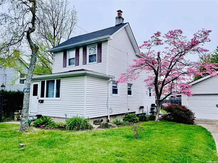 Charming 2 Bedroom Side Hall Colonial Just Blocks From The Beach. Inviting, Enclosed Front Porch With French Doors Leading To The Living Area. Large Eat In Kitchen, 2 Full Baths, Full Unfinished Basement And Detached 2+ Car Garage. Gas Boiler & Water Heater Only 4 Years Young, Brand New Roof & Hardwood Floors On Both Levels.