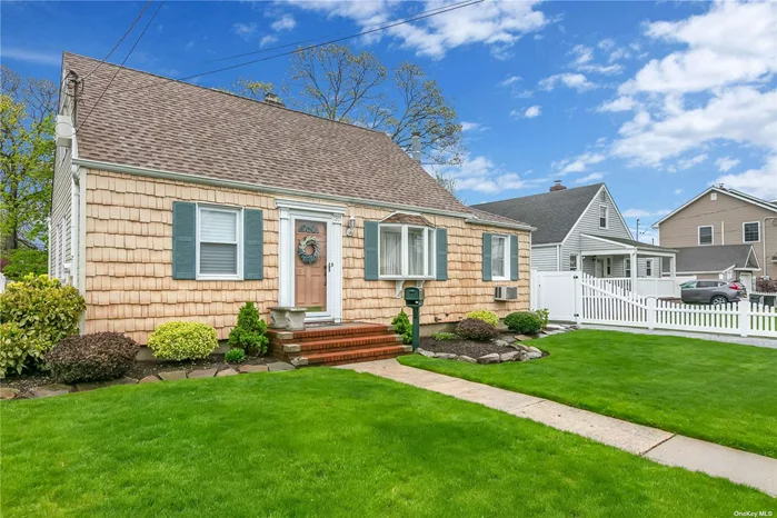 Beautiful Cape situated on quiet mid-block features great curb appeal w/ vinyl sided exterior, newer blacktop & brick driveway, LR w/ refinished H/W flrs, FDR or Den w/ refinished H/W flrs, knotty pine ceiling, vaulted ceiling & skylight, updated EIK w/ pine cabinets, granite countertops, vaulted ceiling, newer skylight, track lighting, gas cooking, & built-in microwave. 2nd flr MBR w/ new wall to wall carpeting & MBR 1/2 Bath. Bsmt newer finished Family Rm, Laundry Rm w/ new washer & dryer, separate Entr Cntr, LR/BR, & Fbth. All windows replaced, interior raised panel doors, newly insulated. Oil heat, heating system 10 years old, 275-gallon oil tank 10 years old, new separate gas HW heater. Roof 2 years old stripped to sheathing. Oversized, detached 2 car garage, built in 2013 w/ pull-down attic w/ hideaway stairs. Large, oversized, park-like, privately fenced backyard, 150ft deep, brand new 6ft PVC fencing, deck w/ hot tub w/ 2 new motors. Convenient to all transportation & shopping.