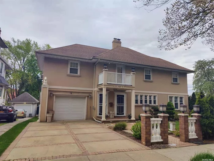 The 2nd floor includes master Br with cathedral ceiling, 2nd Br(currently used as an office) w wall-to-wall cedar closet, Kit w granite countertops, wine cooler, dining room with electric fireplace, balcony, LR & full bath w double sink vanity...short distance to LIRR..close to bus, close to Park, Close to school, Close to Shops.