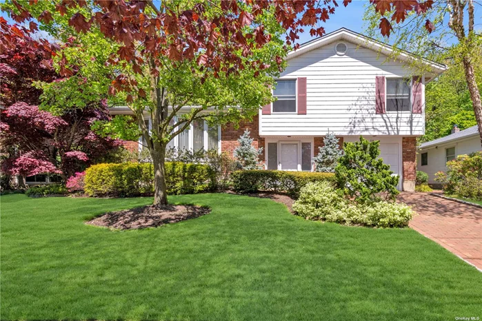 Meticulously maintained 4 bedroom expanded split-level house with excellent curb appeal, brick paver driveway, located on a cul-de-sac, in the neighborhood of Harbor Hills. The tiled entrance foyer brings you past an elegant powder room and access to the one car garage to the extra-large expanded primary bedroom and primary bathroom looking out at a lush and private landscaped backyard. The hardwood flooring on the first floor showcases an ample spaced sun filled living room with a vaulted ceiling, floor to ceiling windows and a formal dining room area with access to the deep expanded updated eat-in kitchen with a single slider door opening to a wraparound premium wood deck. The third floor is fully carpeted over hardwood floors and has 3 ample-sized bedrooms with an updated bathroom. This house is close to the Port Washington train station, Lions Field, St. Peter&rsquo;s, and the Waterfront. 3 zone gas heat, central air, jacuzzi tub, steam shower, kitchen water filtration, multi-level alarm