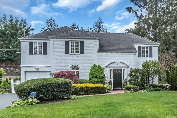 Beautifully updated and impeccably maintained 4 bedroom, 2.5 bath brick Colonial. Set in the heart of South Strathmore, this classic home features an open concept layout with gleaming hardwood floors and quality craftsmanship throughout. Spacious living room with fireplace, formal dining room, custom eat-in kitchen adjoining family room with fireplace. Close proximity to Munsey Park School, transportation and the Americana shopping center make this home your perfect choice.