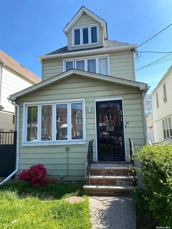 Lovingly maintained 3 bedroom home in Queens Village. First floor features a porch, Living Room, Formal dining room Eat in Kitchen and 1/2 bath Second floor features 3 bedrooms - Full bath- Full finished attic. Full finished basement with separate boiler room, laundry room and a full bath.  Close to all shopping