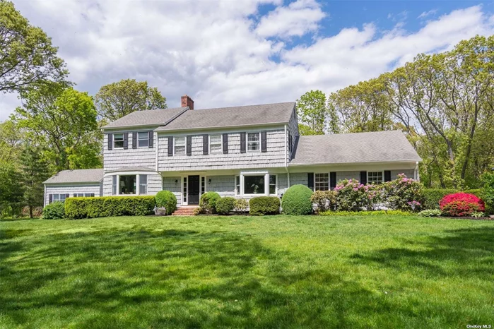 Classic Center Hall Colonial with significant updates and additions. Beautiful recently renovated kitchen with marble countertops, a FP and high end appliances. Just off of the kitchen is a formal sunny DR and just around the corner is a large Great Room with 16ft ceilings that opens to an expansive terrace and awning with views of the sparkling water gunite pool that was redone in 2021. This home also includes a LR with high ceilings and fireplace as well as a 1st floor playroom/den. 3 sets of stairs allow for separation and privacy or flow between bedrooms depending on desire. The Primary Bedroom is elegant and spacious with its own side stairs and can be either connected to the other 2nd floor bedrooms or can be closed off for some peace and quiet. The center stairs take you up to 3 bedrooms and 3 baths and the third private staircase leads you to a 5th bedroom with FB. Multiple stair features once again for whatever flow you desire. Basement with room for gym. Priced to sell!