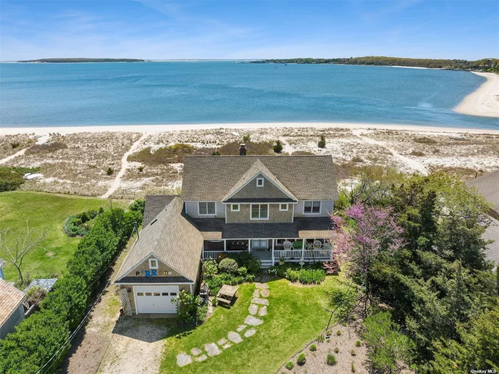 Nassau Point Gem Nestled Between Peconic Bay And The Protection Of Haywaters Cove. Property Features Private Front Yard Dock, Incredible Sugar Sand Beach & Water Views From Every Room In The Home With 4 Bedrooms, 3 Baths, Large Open Living Areas, Main Level Master.