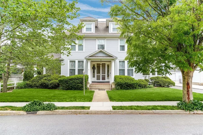 Stunning 1913 Colonial in the heart of the Hamlet of Oyster Bay, offered for only the second time in decades. Best of both worlds with sensitive updates carefully considering historic details. All begins with reception foyer with restored original windows believed to be from the Tiffany Estate. Library, living room with fireplace, dining room all enhanced by oak hardwood floors with mahogany inlays. The versatile eat in kitchen Includes multiple dining areas with wood burning stove and new old growth wide plank wood floors. Front & butler staircases lead to the upstairs bedrooms and bathrooms, highlighted by primary 2 room suite. Incredible amount of useable space with finished walkout basement and expansive walk up attic. Flat beautiful property with 2-car garage with artist&rsquo;s loft. Recently added 20 KW Generator.